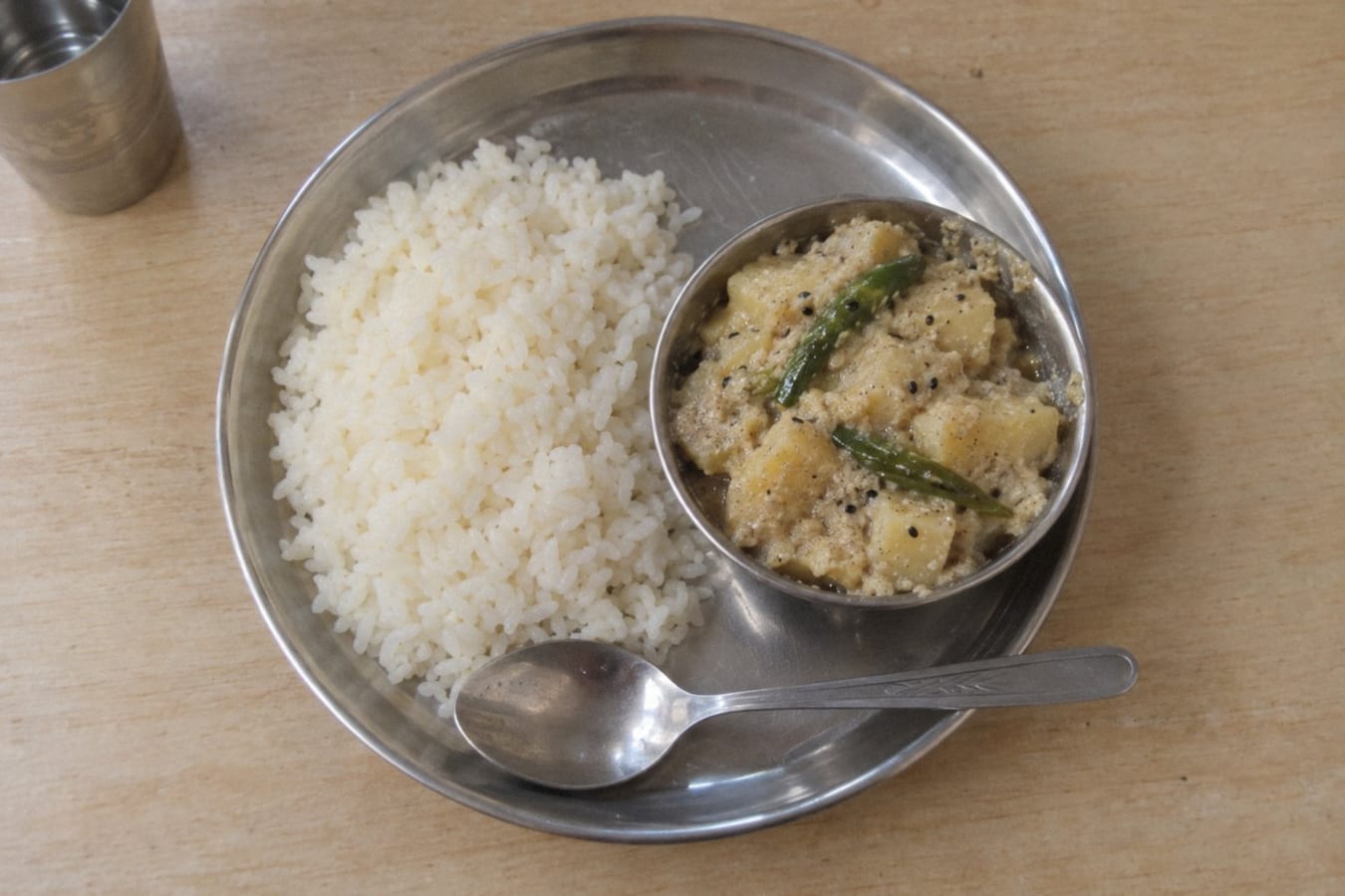 Aloo posto with steamed rice