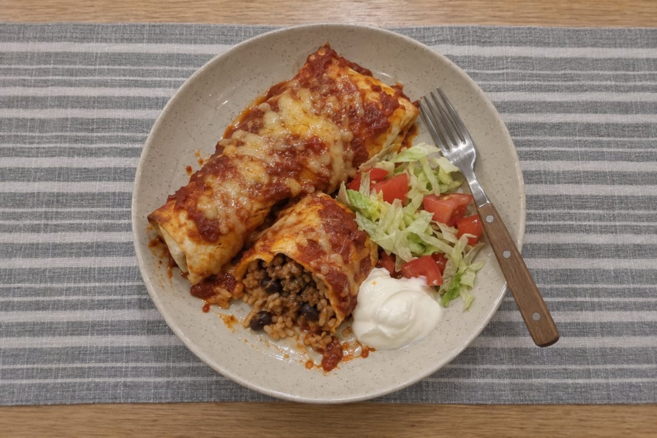 Baked beef, rice and bean burritos