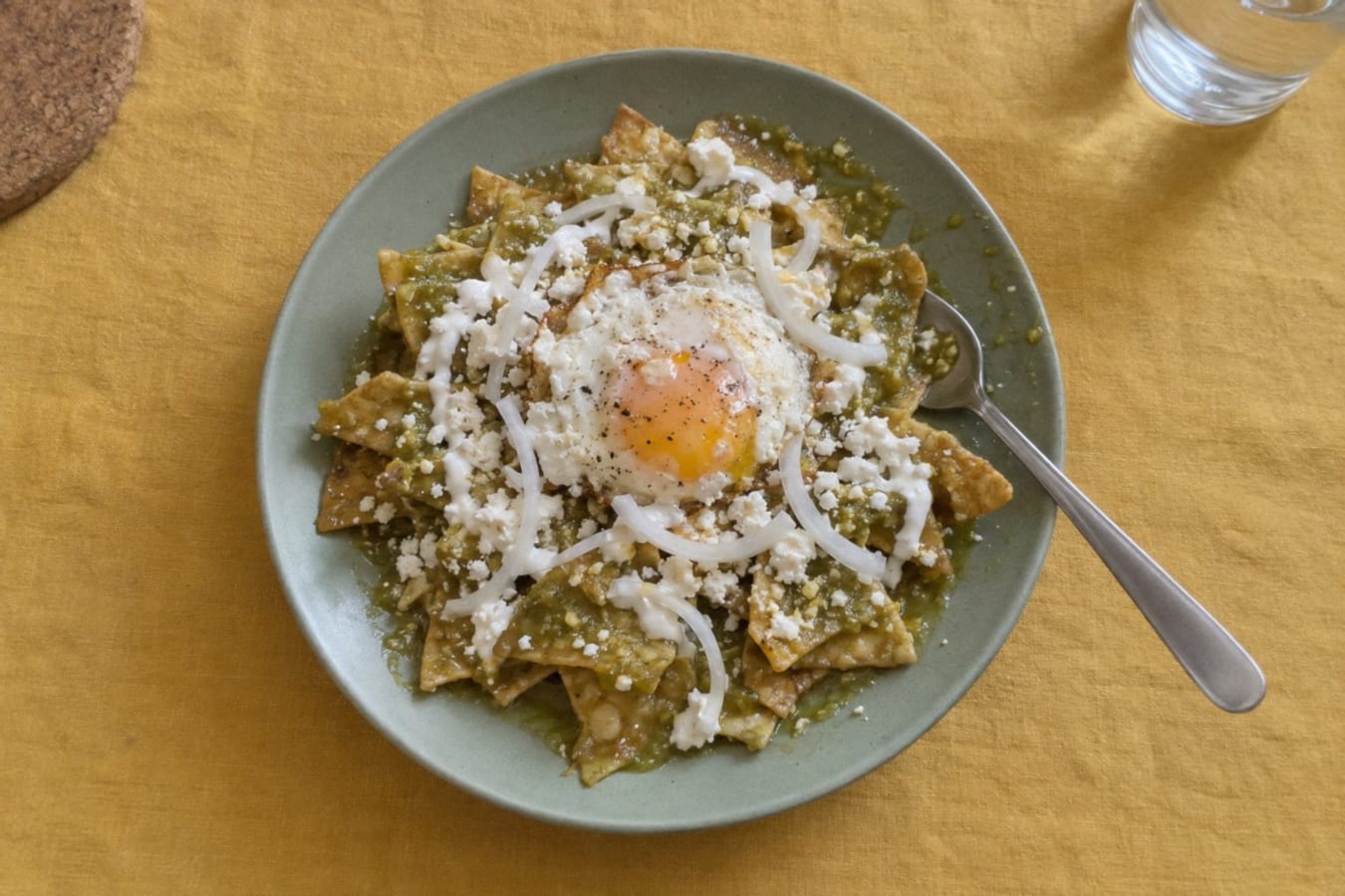 Chilaquiles verdes – tortilla chips in green salsa with fried eggs
