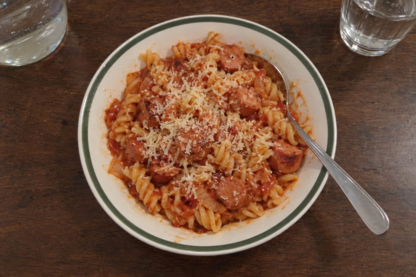 Pasta with frankfurters in tomato sauce