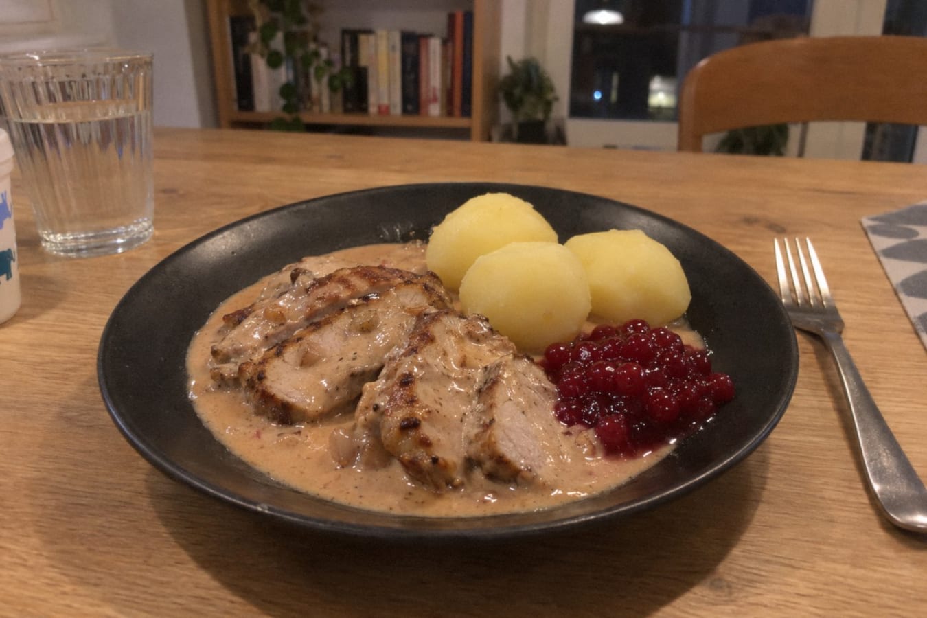 Pork loin in lingonberry cream sauce with boiled potatoes