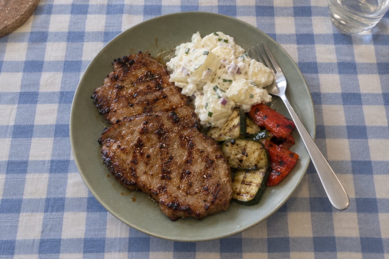 Grilled pork neck with potato salad