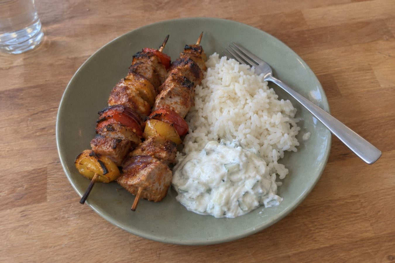 Pork skewers with rice and tzatziki