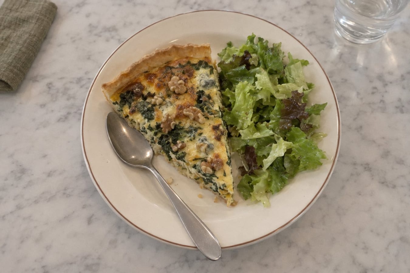 Kale and blue cheese pie with walnuts and green salad
