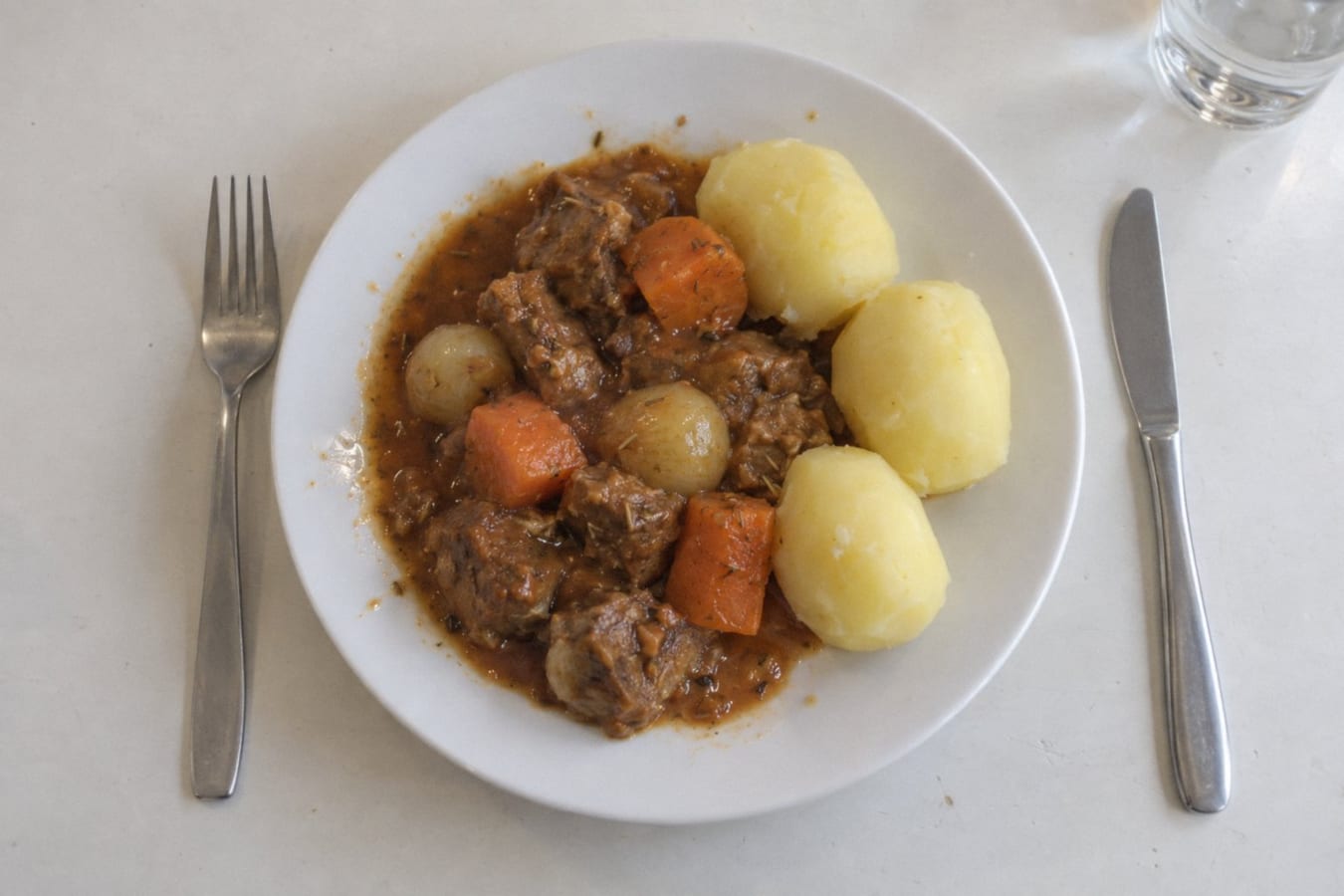 Lamb stew with rosemary, carrots and boiled potatoes