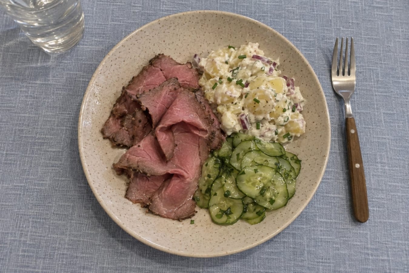 Roast beef with potato salad and pressed cucumber