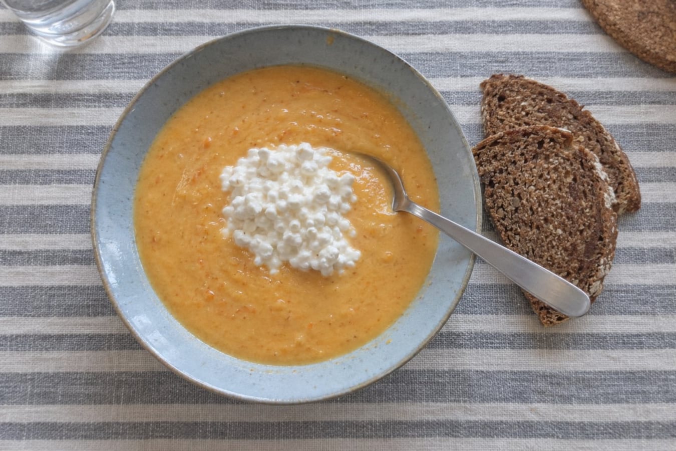 Creamy root vegetable soup with cottage cheese and wholemeal bread