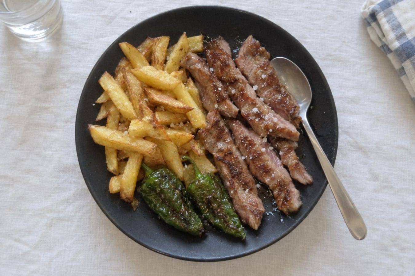 Griddled Ibérico pork secreto with chips and fried green peppers