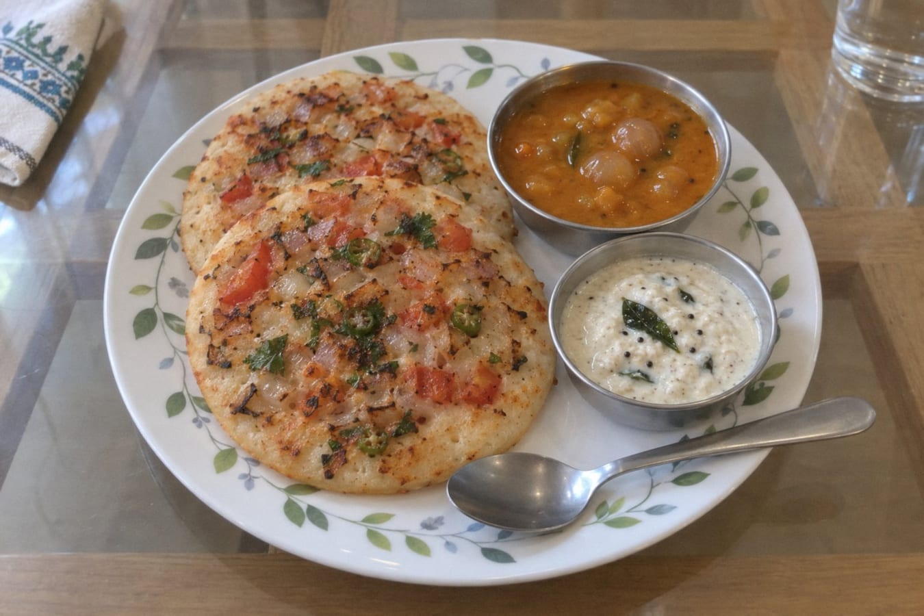 Uttapam with sambar and coconut chutney
